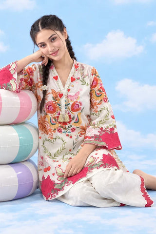 Close-up of heart neckline, floral hem and trouser detail